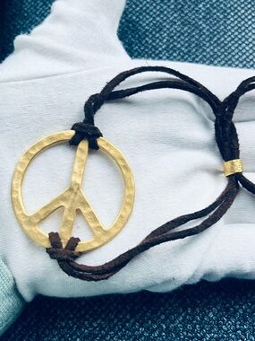 Gold tone Peace Sign Leather Cord Bracelet
